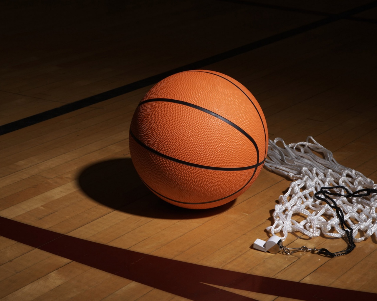 A Basketball Net And Whistle