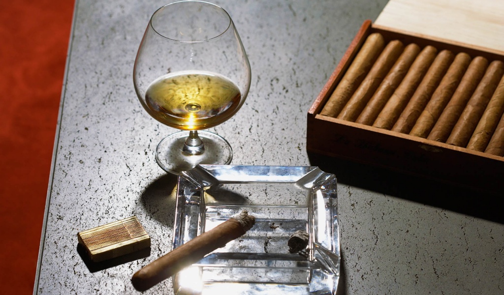 Close Up Of Cognac Glass And Cigars