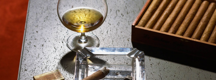 Close Up Of Cognac Glass And Cigars