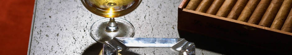 Close Up Of Cognac Glass And Cigars