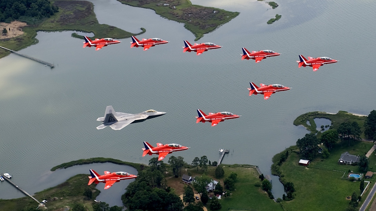 F22 And Red Arrows