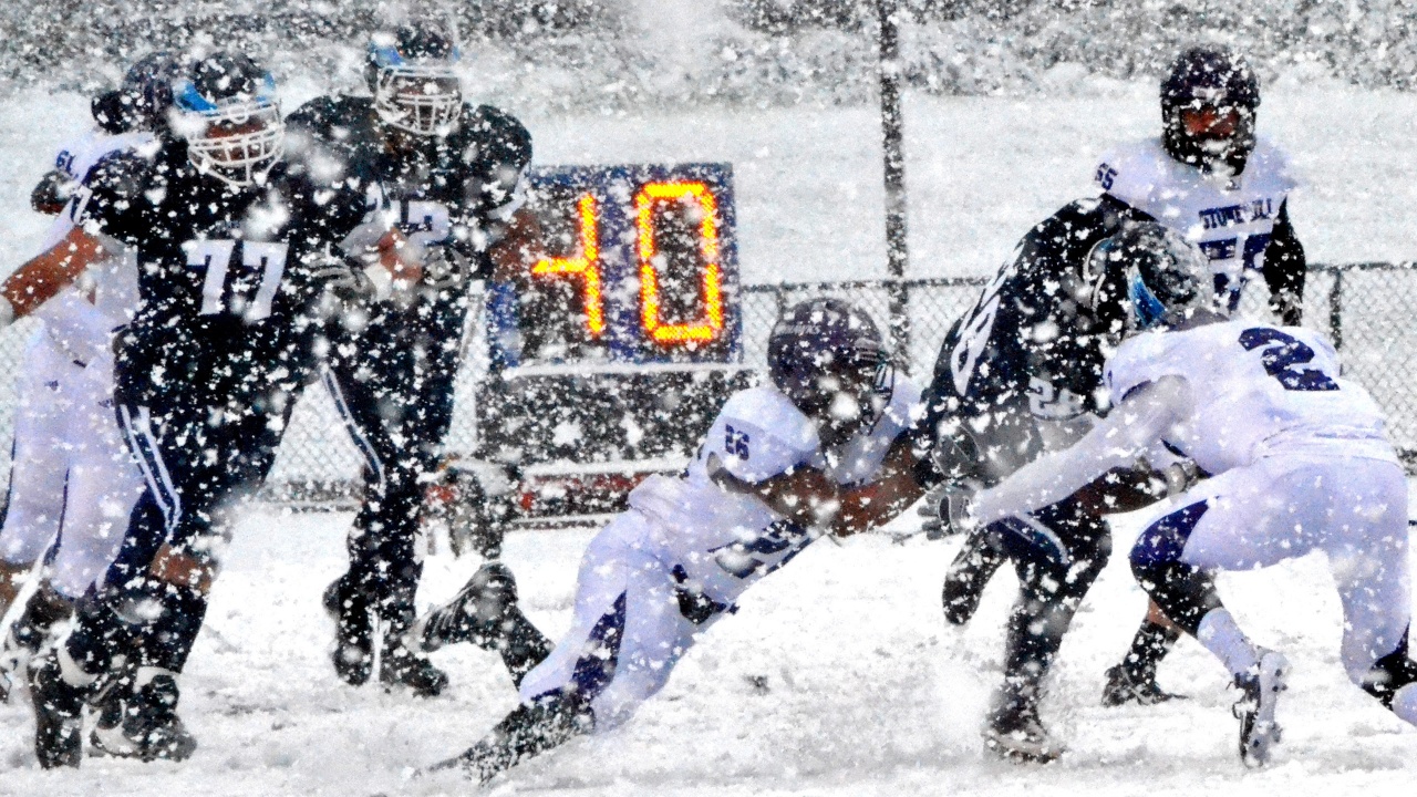 Football Match on a Snowy Blizzard