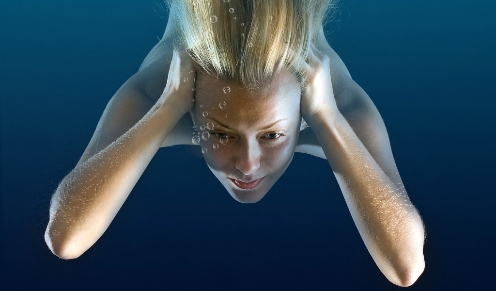 Girl Under Water Immersing Blonde Bubbles