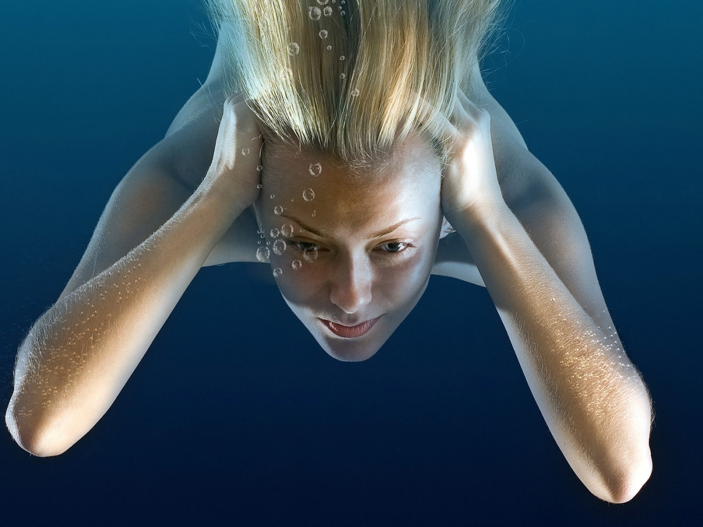 Girl Under Water Immersing Blonde Bubbles