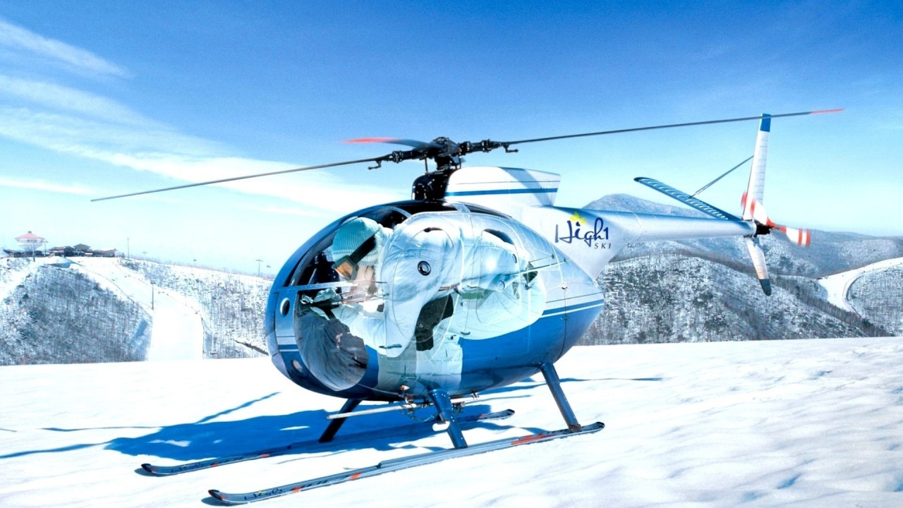 Mini Helicopters On The Snow Capped Mountain