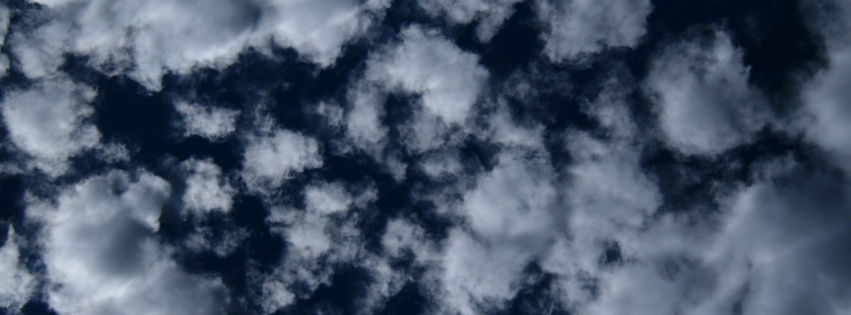 Puffy Clouds On Dark Blue Sky Texture