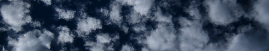 Puffy Clouds On Dark Blue Sky Texture