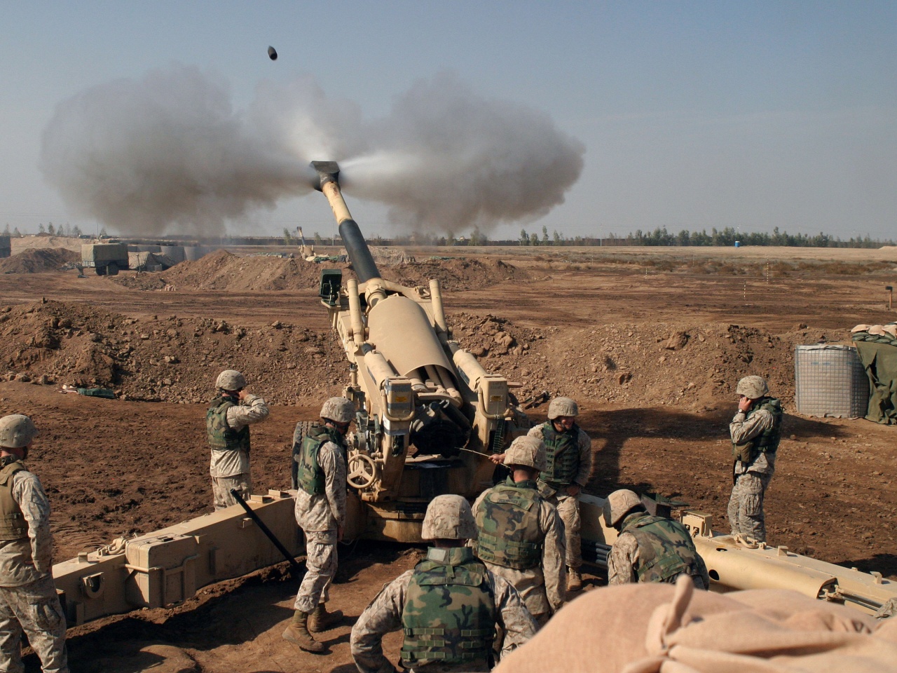 Soldiers Fire From Howitzers