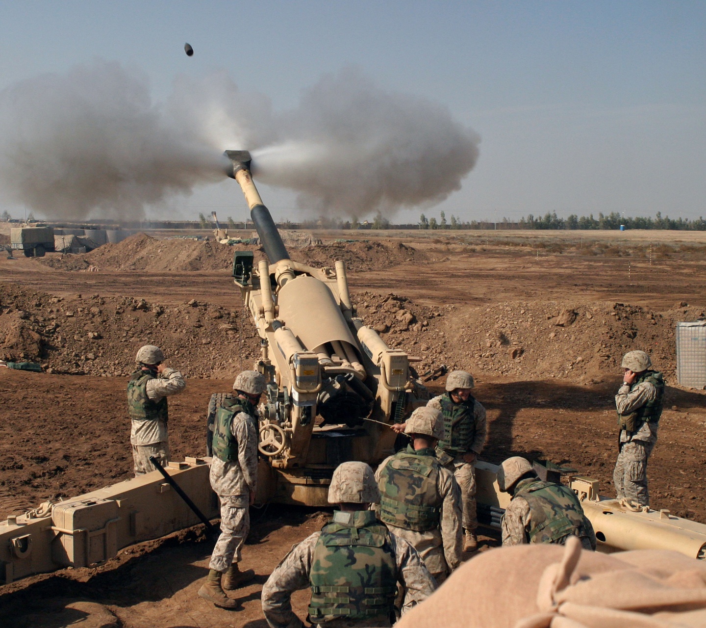 Soldiers Fire From Howitzers