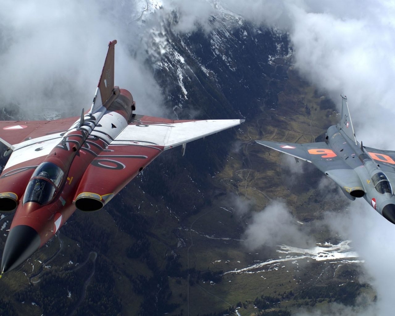 The Two Military Fighter Jets Flying Together