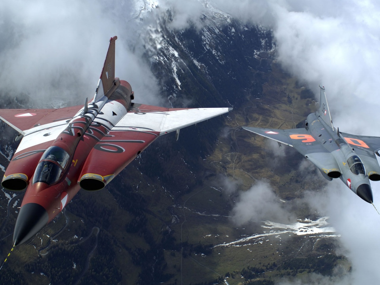 The Two Military Fighter Jets Flying Together