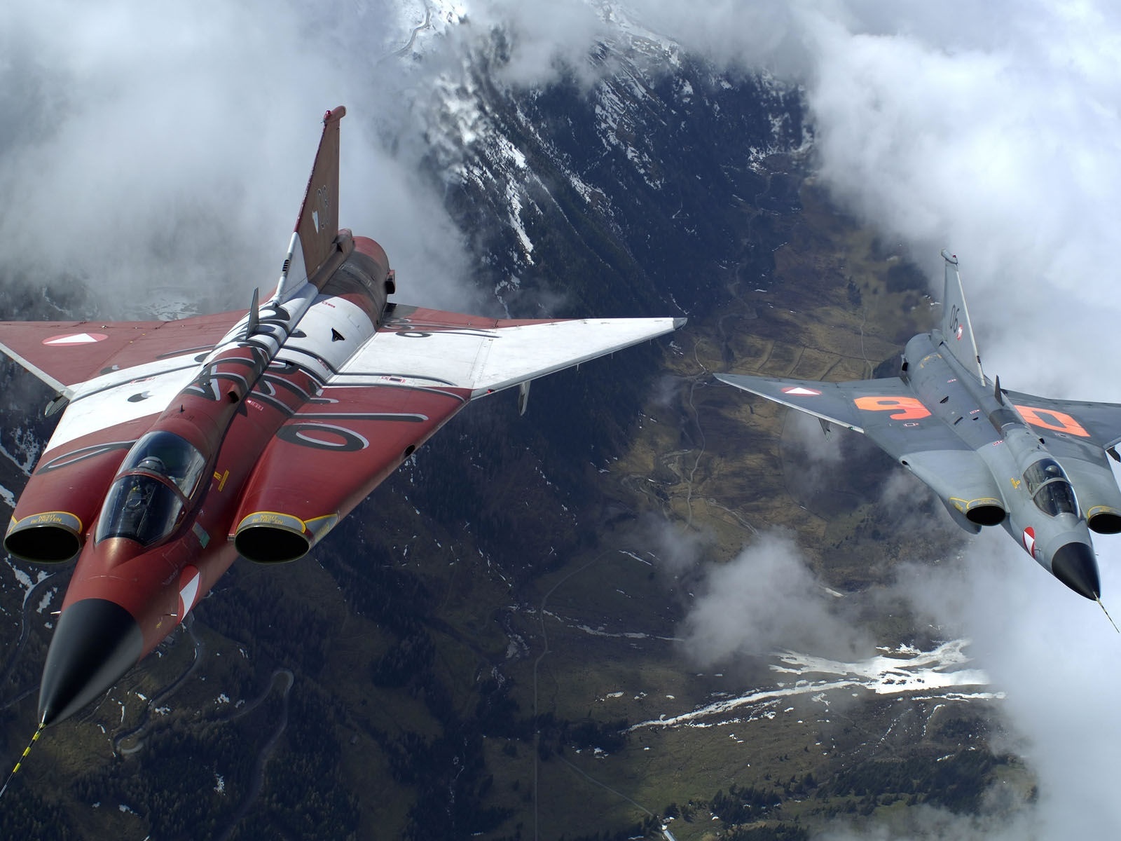 The Two Military Fighter Jets Flying Together