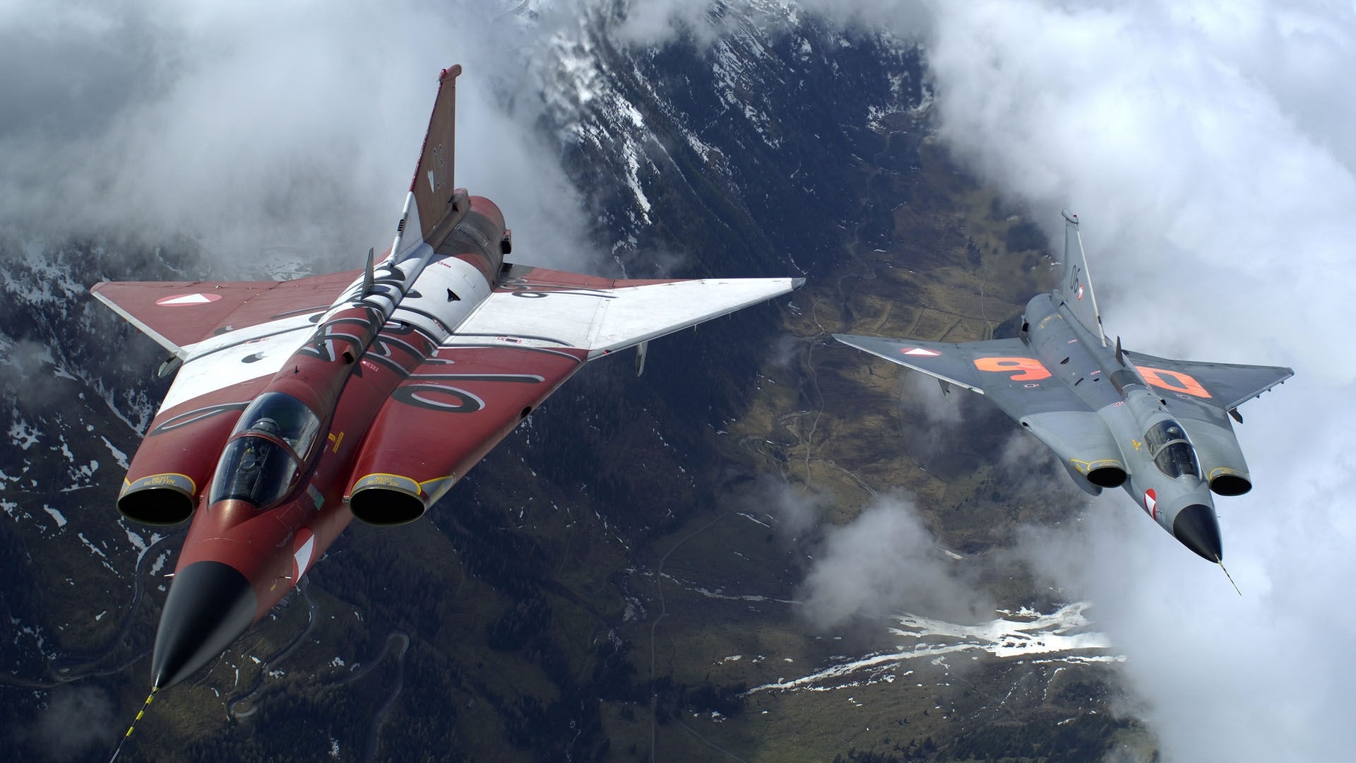 The Two Military Fighter Jets Flying Together