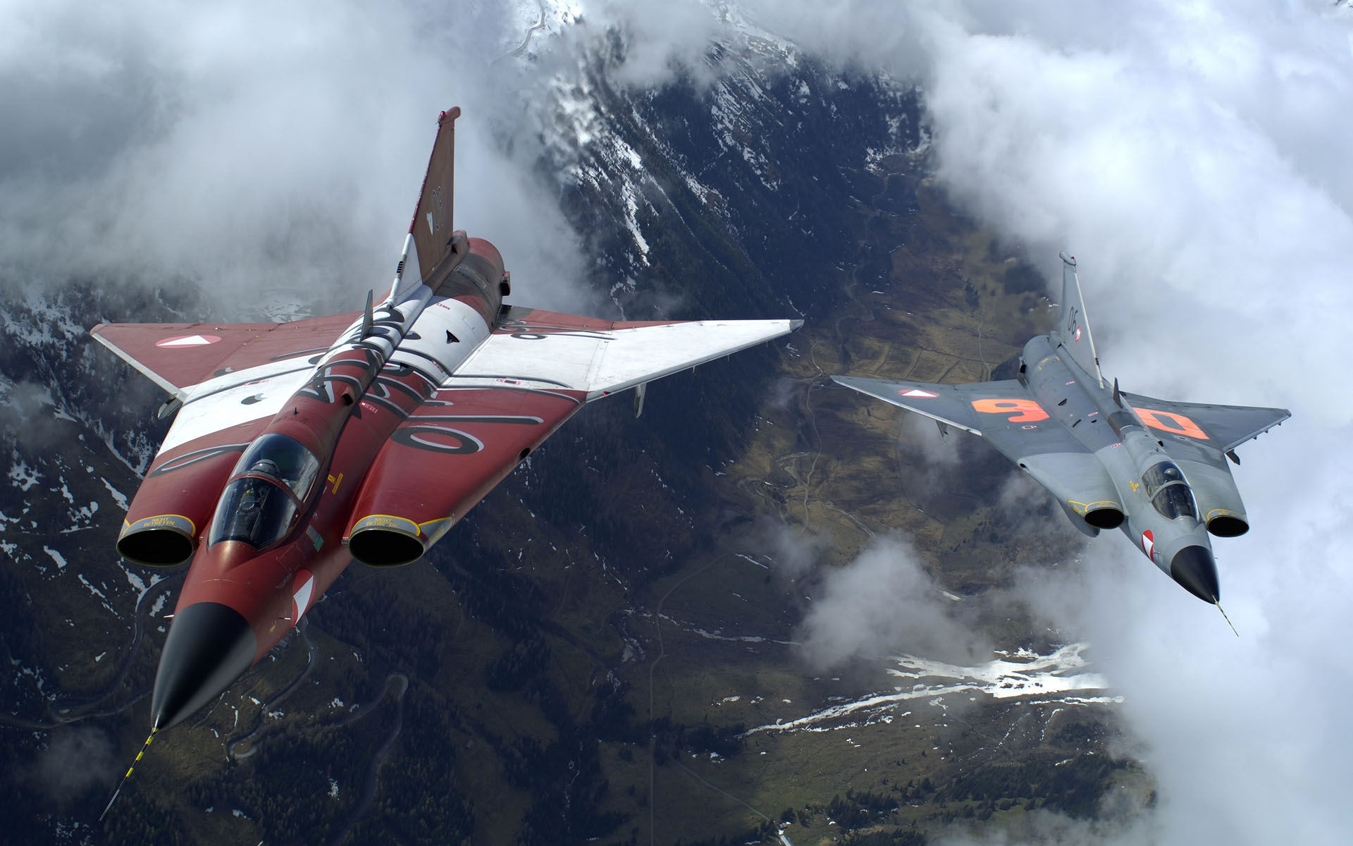 The Two Military Fighter Jets Flying Together