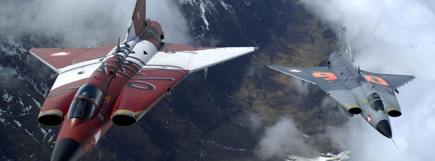 The Two Military Fighter Jets Flying Together