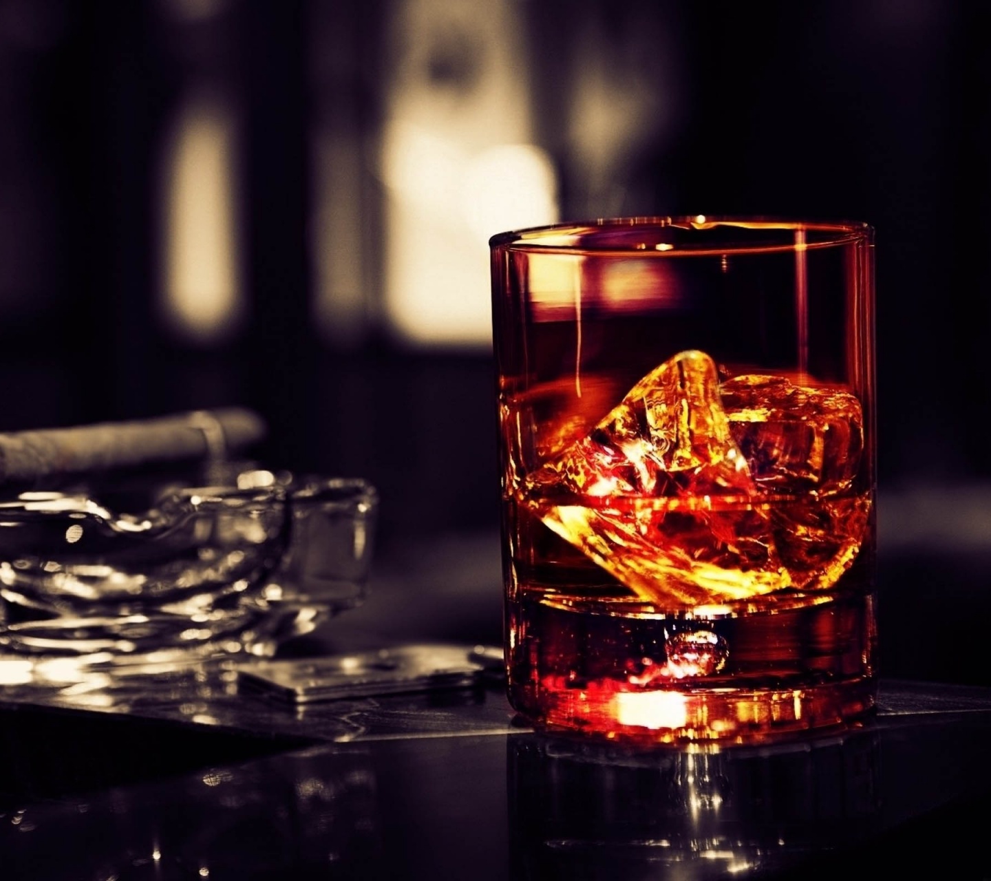 Whisky Glass With Cigar On The Table