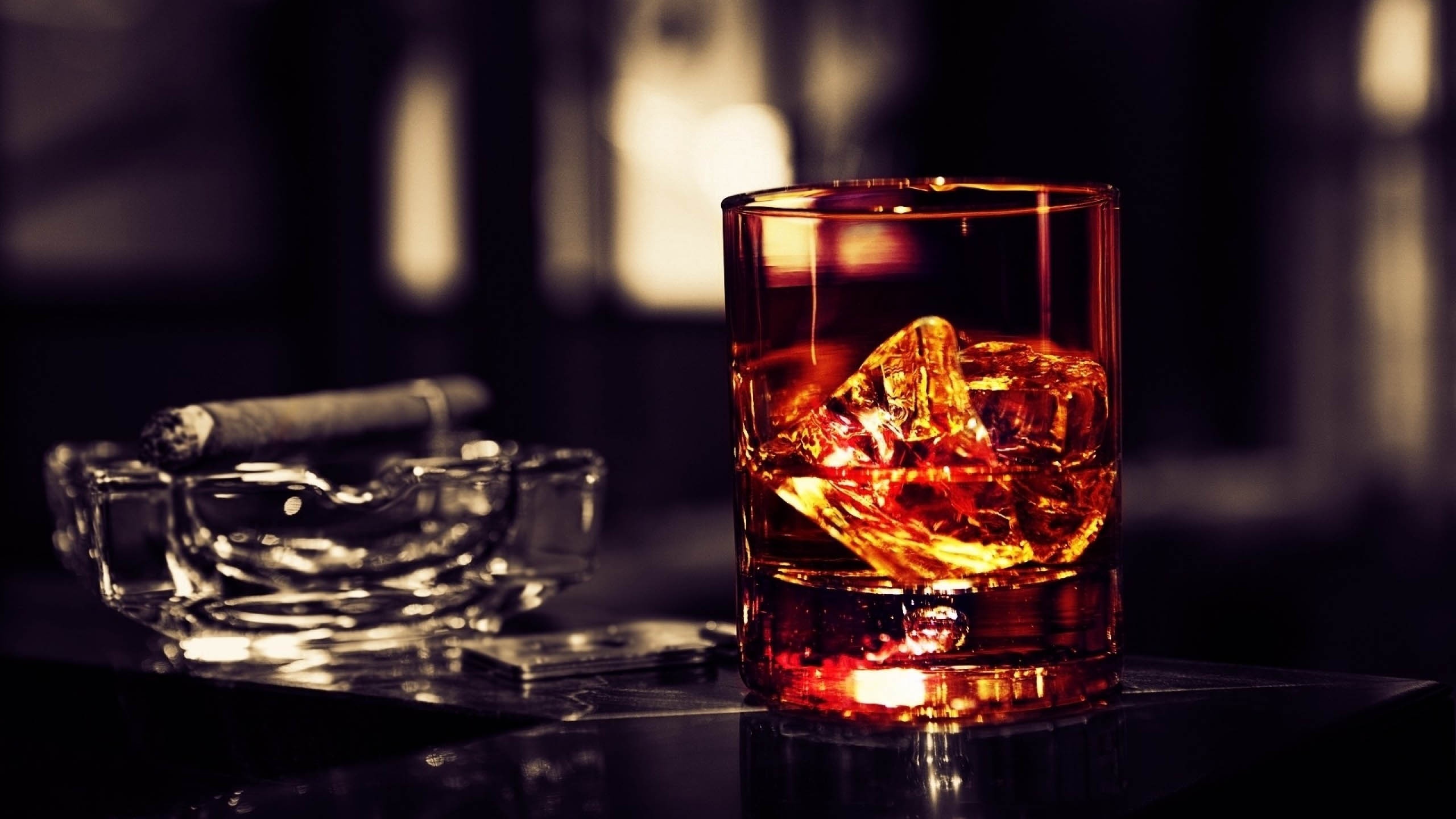 Whisky Glass With Cigar On The Table